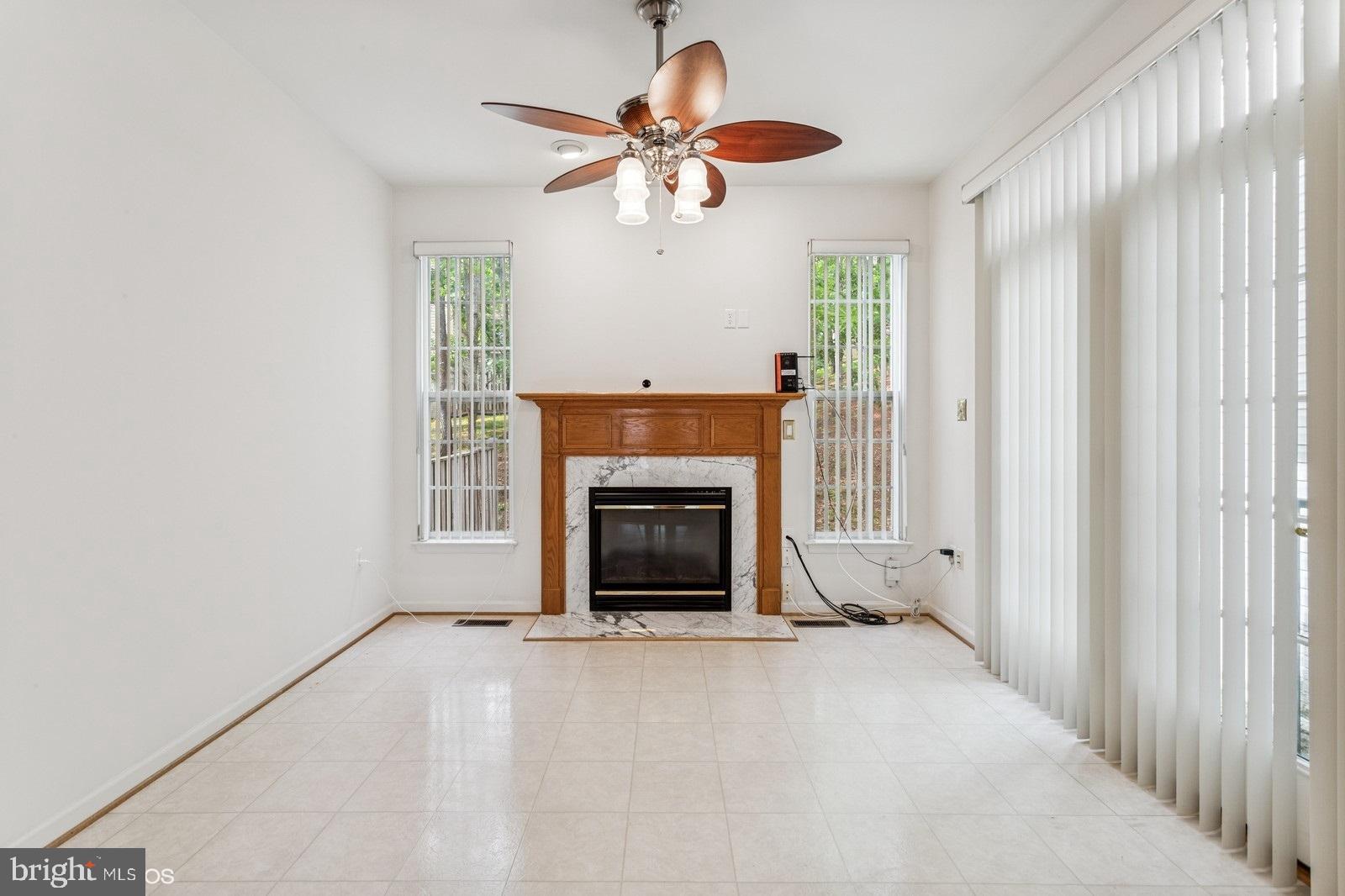 7315 Serenade Circle Clinton, MD 20735 - Photo 14 of 36 a view of a livingroom with a fireplace and a window