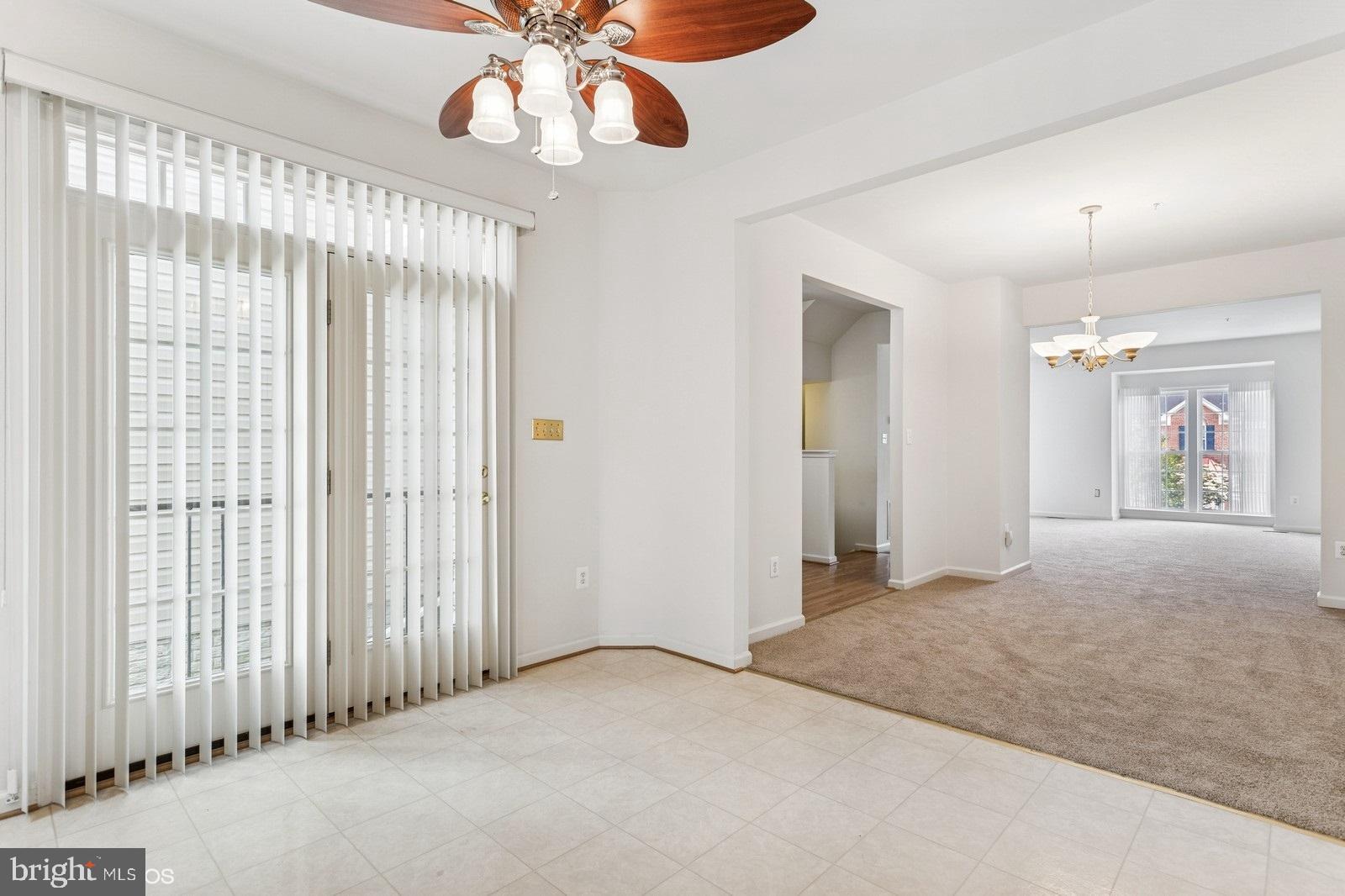 7315 Serenade Circle Clinton, MD 20735 - Photo 16 of 36 a view of a chandelier fan and windows in a room