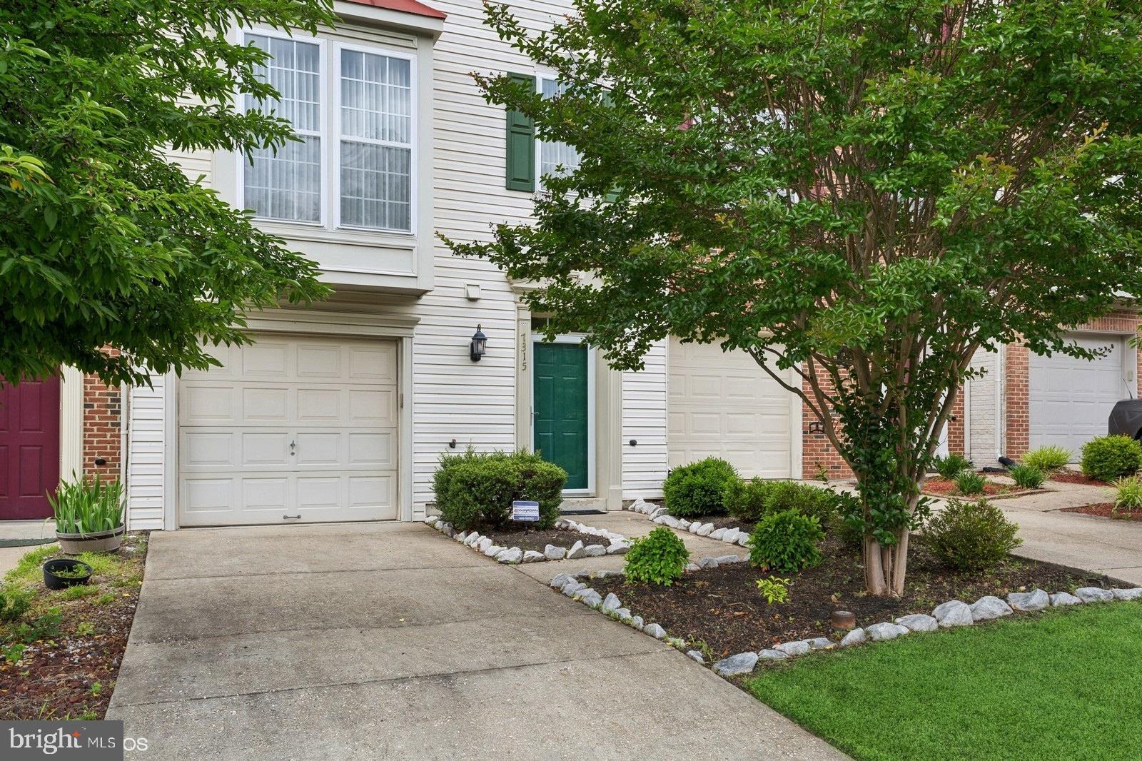 7315 Serenade Circle Clinton, MD 20735 - Photo 2 of 36 a front view of a house with garden