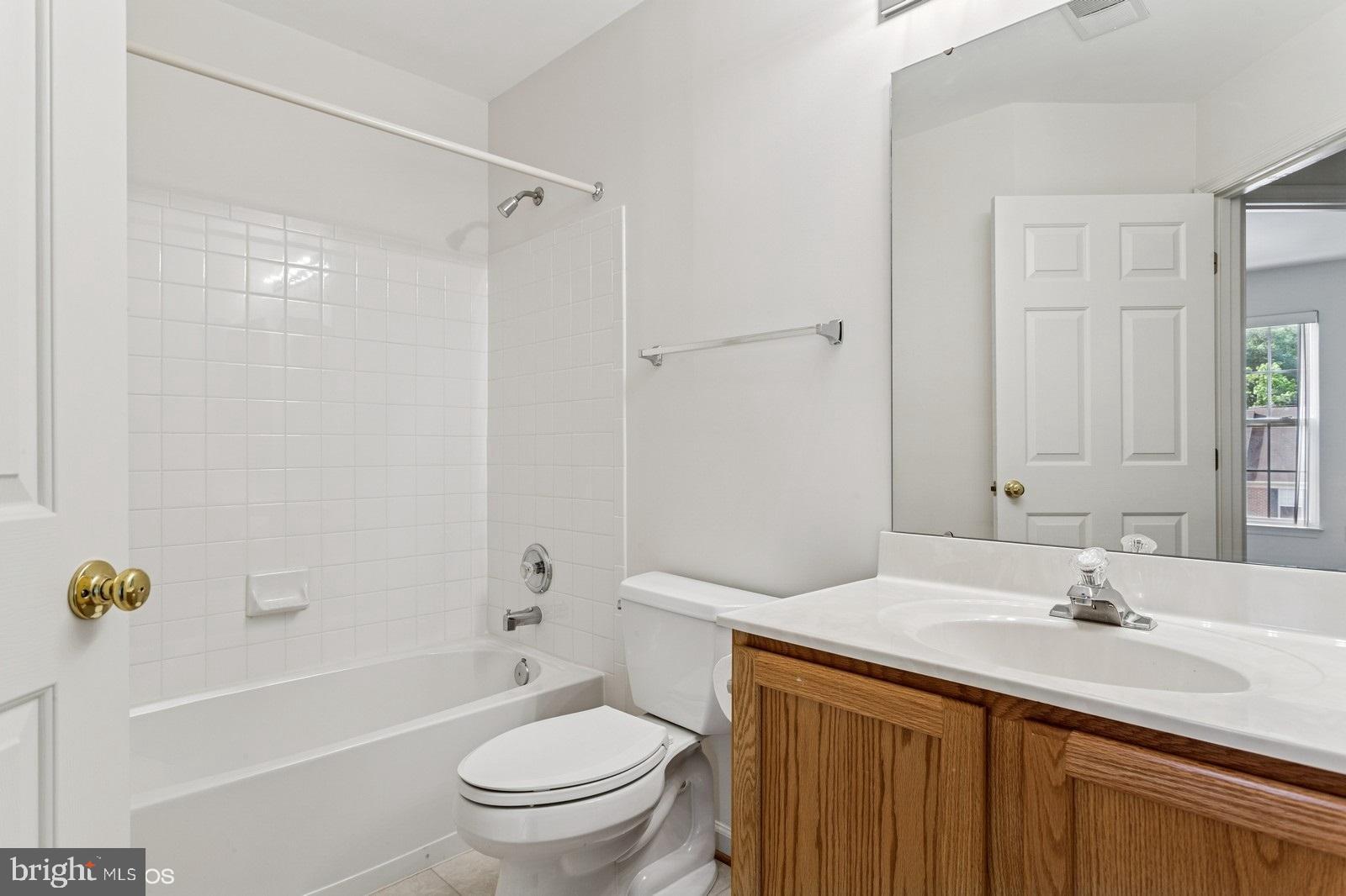 7315 Serenade Circle Clinton, MD 20735 - Photo 25 of 36 a bathroom with a sink toilet tub and shower