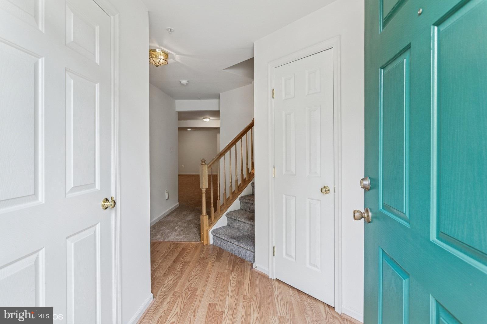 7315 Serenade Circle Clinton, MD 20735 - Photo 3 of 36 a view of a hallway with wooden floor and entryway