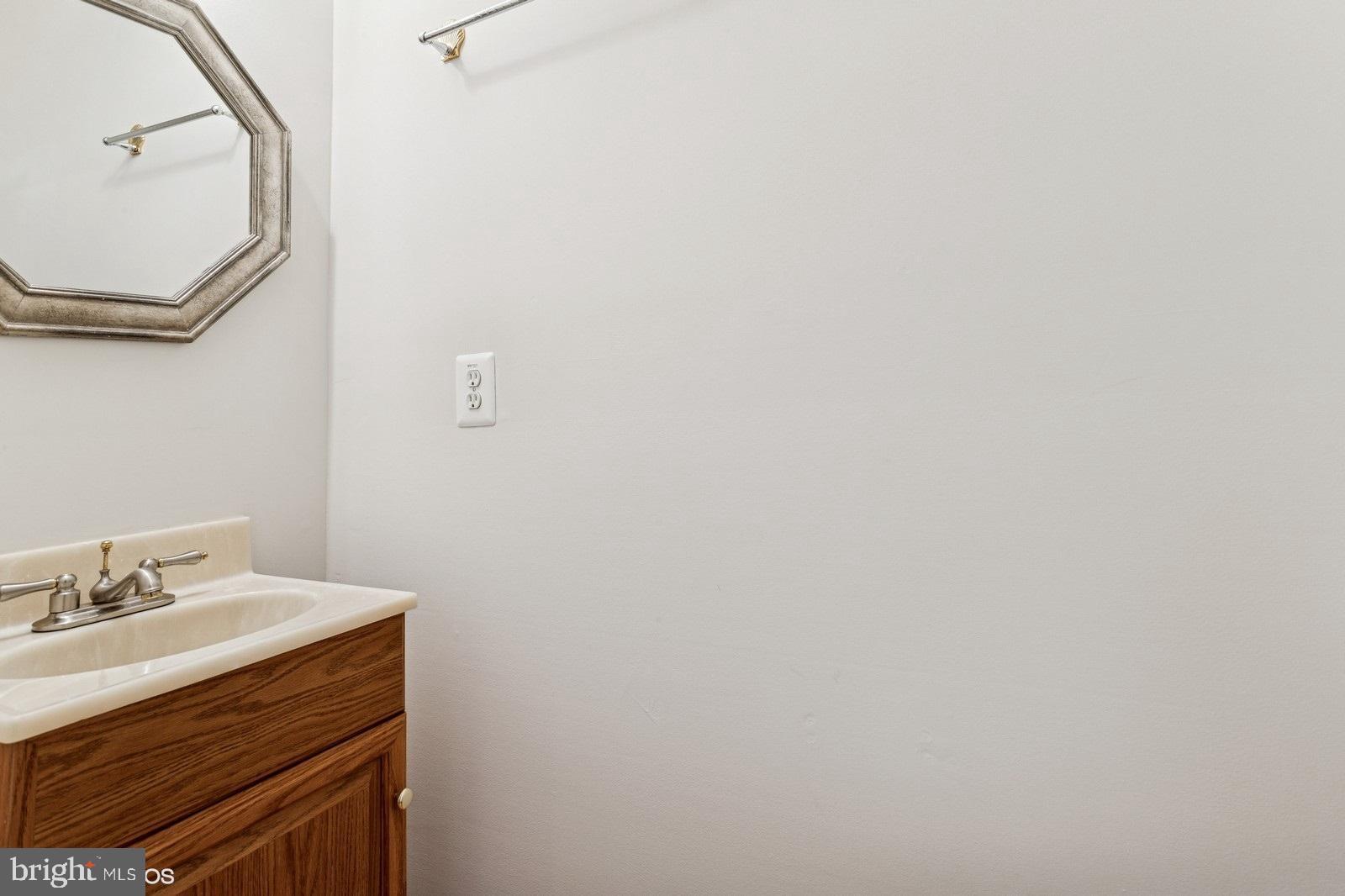 7315 Serenade Circle Clinton, MD 20735 - Photo 7 of 36 a bathroom with a sink vanity and a mirror