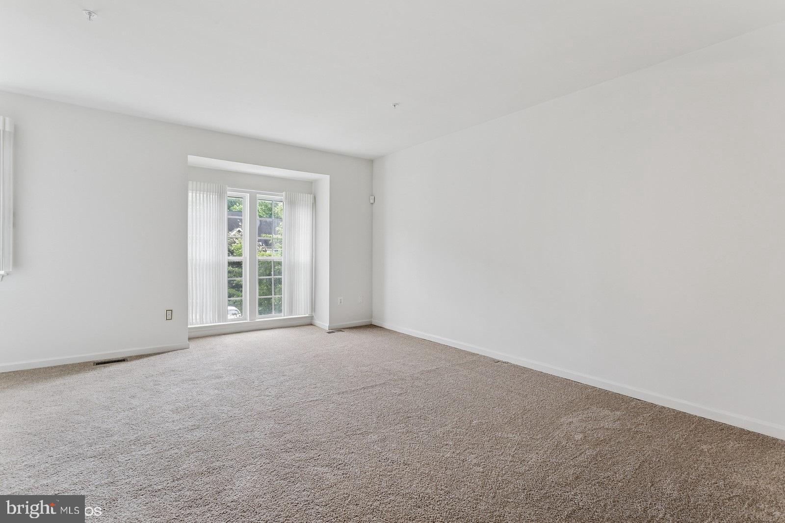 7315 Serenade Circle Clinton, MD 20735 - Photo 8 of 36 an empty room with windows