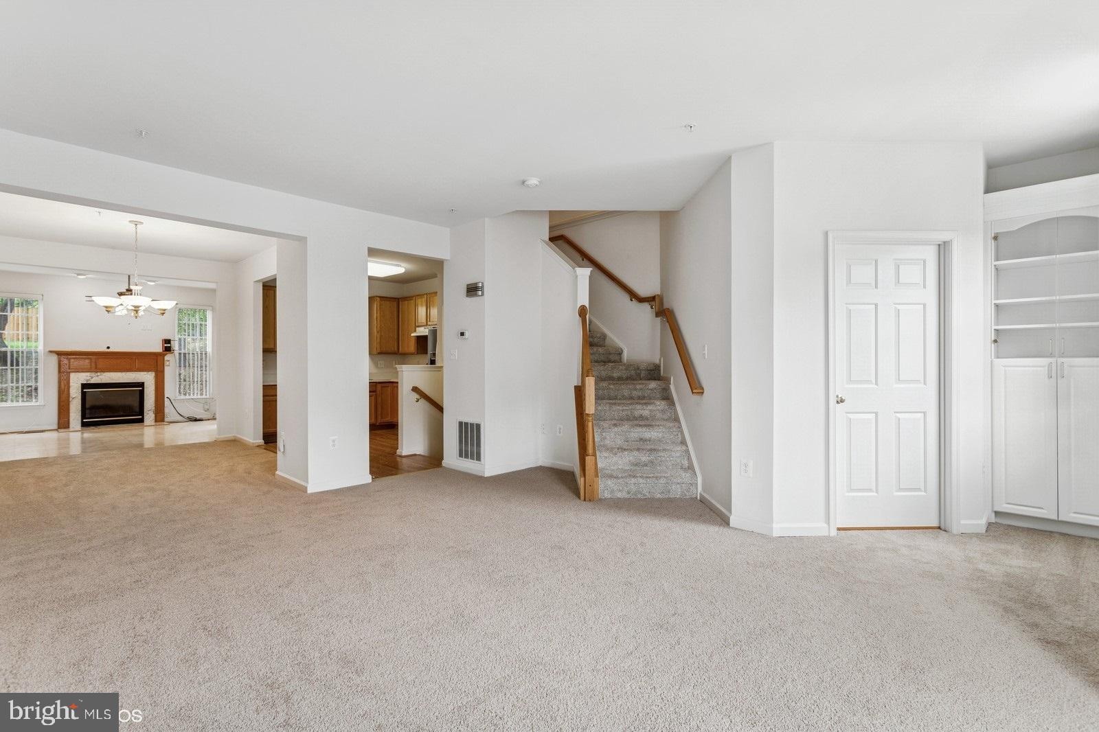7315 Serenade Circle Clinton, MD 20735 - Photo 10 of 36 an empty room with furniture and a fireplace