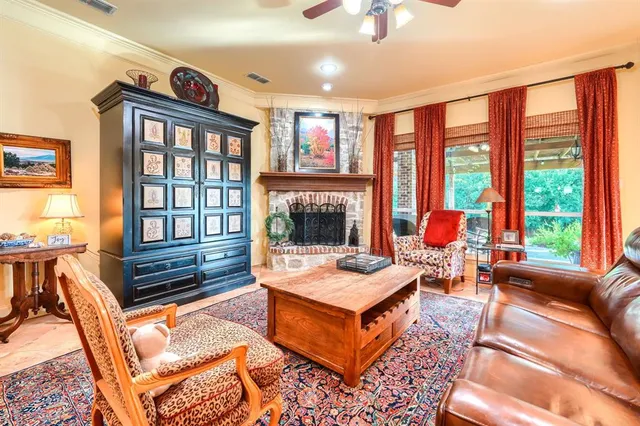 a living room with furniture a fireplace and outer view