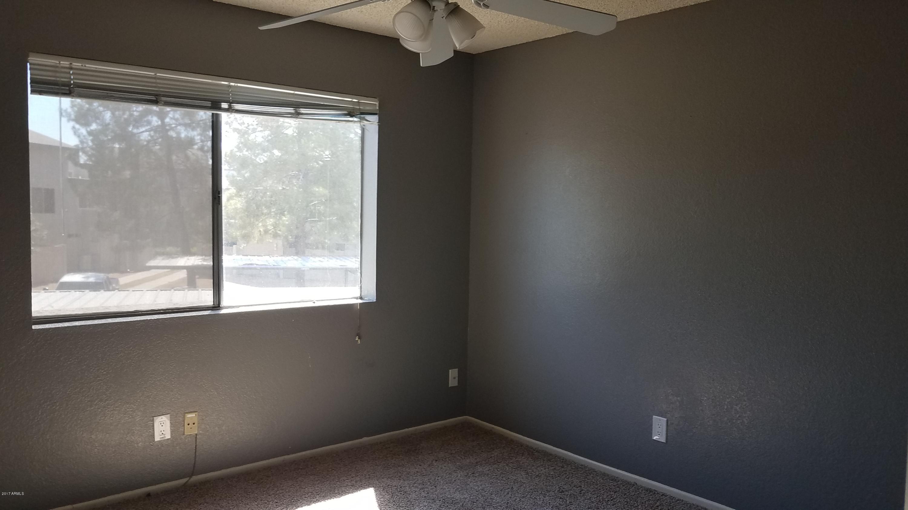 19601 North 7th Street, Unit 1049 Phoenix, AZ 85024 - Photo 15 of 26 an empty room with a window