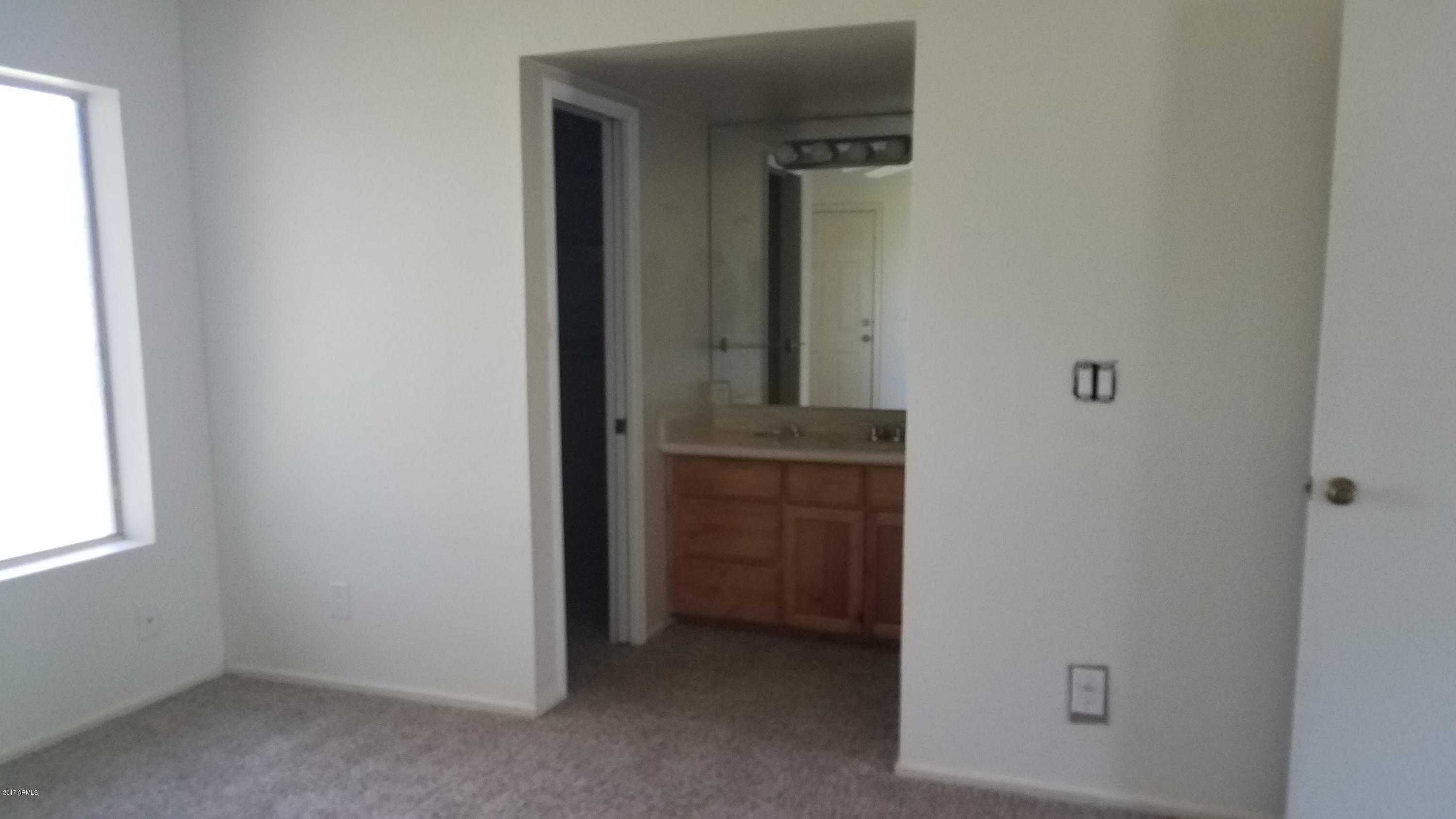 19601 North 7th Street, Unit 1049 Phoenix, AZ 85024 - Photo 18 of 26 an empty room with windows