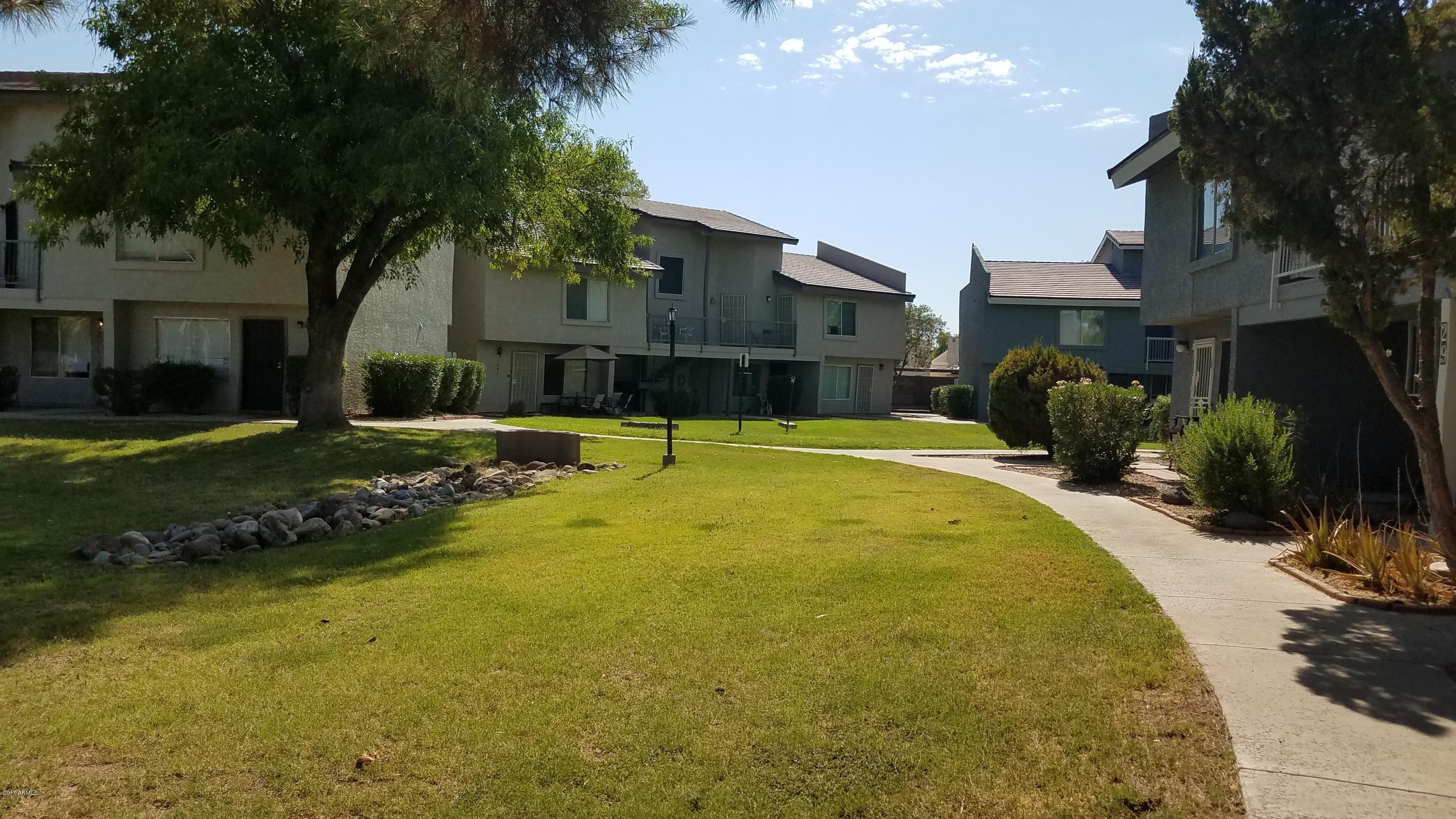 19601 North 7th Street, Unit 1049 Phoenix, AZ 85024 - Photo 24 of 26 a swimming pool with outdoor seating and yard