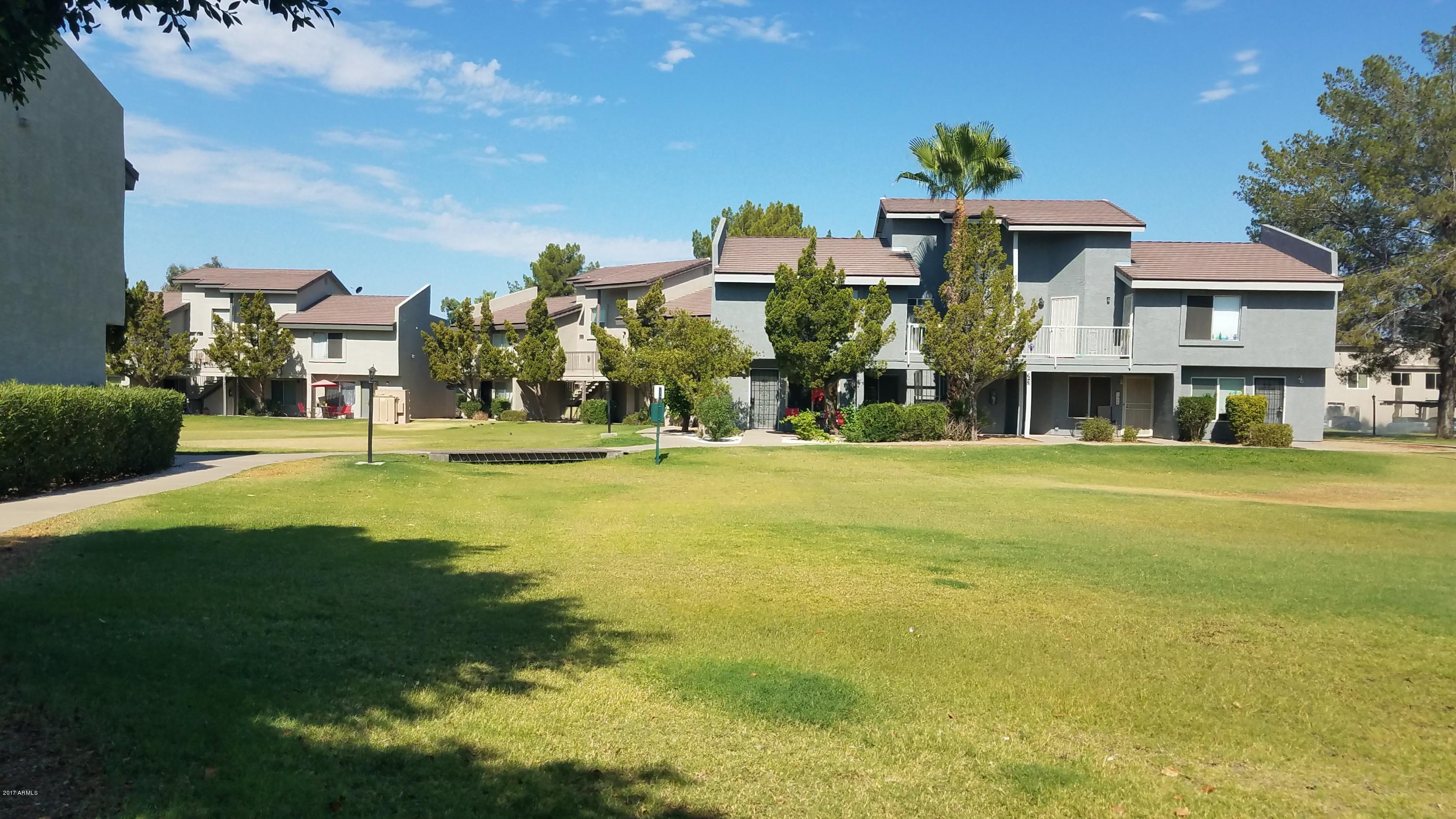 19601 North 7th Street, Unit 1049 Phoenix, AZ 85024 - Photo 26 of 26 a front view of multiple houses with yard
