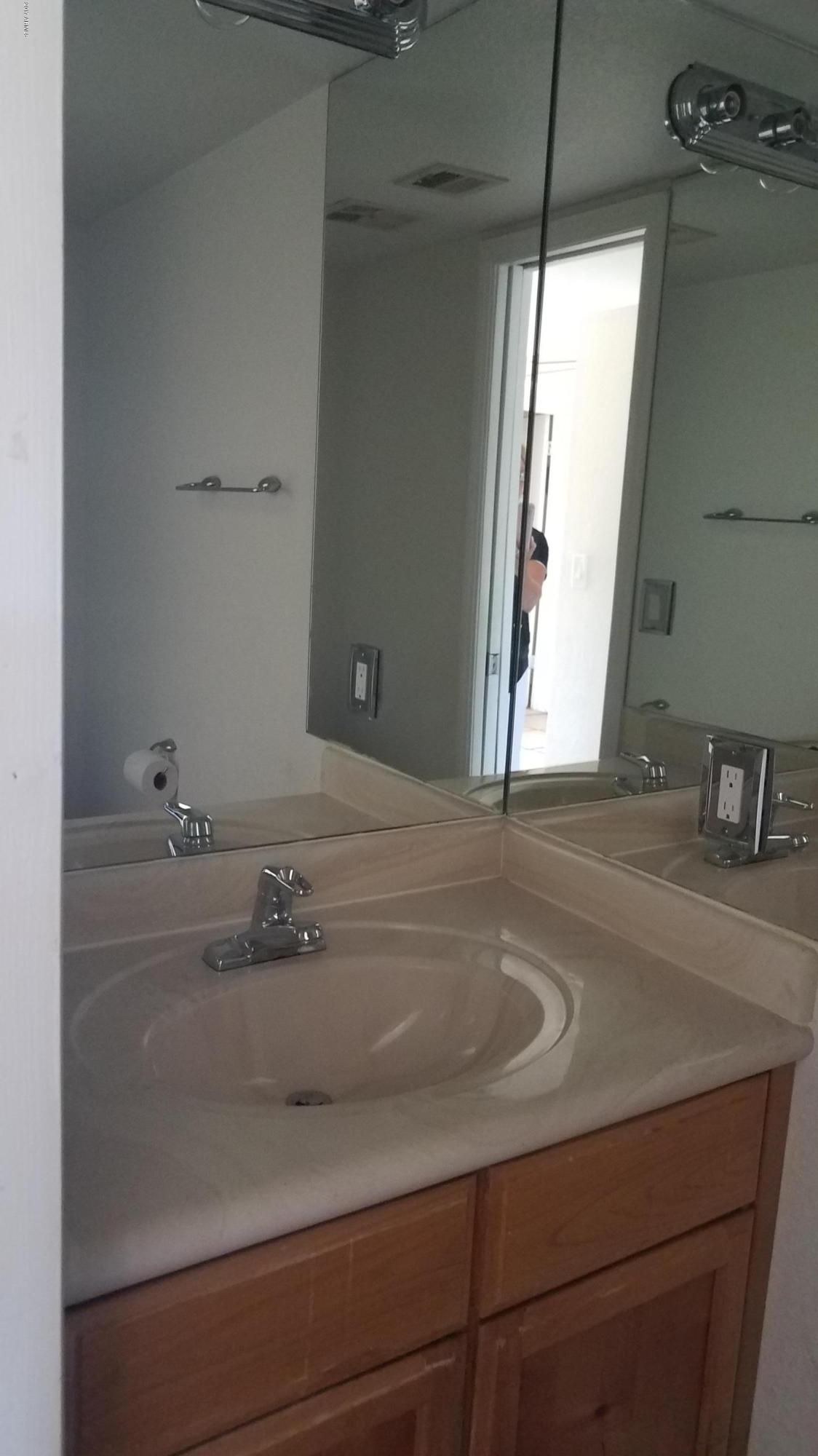 19601 North 7th Street, Unit 1049 Phoenix, AZ 85024 - Photo 10 of 26 a bathroom with a sink and a mirror