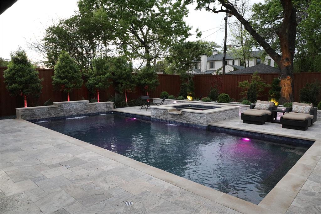5019 Lark Lane Dallas, TX 75209 - Photo 2 of 32 a view of a swimming pool with a lounge chairs