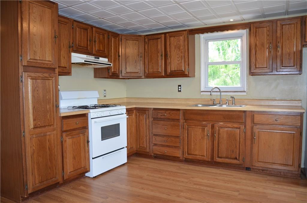 5 Hays Street Rural Ridge, PA 15075 - Photo 4 of 19 Kitchen has new faucet, recessed lights & includes gas range & refrigerator