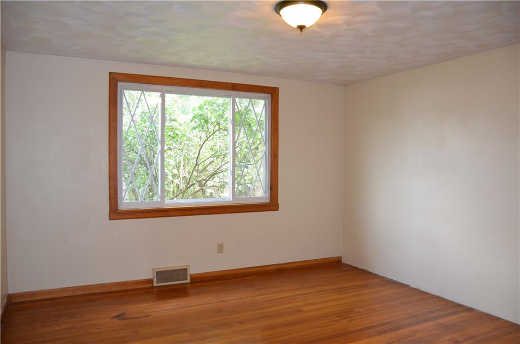 5 Hays Street Rural Ridge, PA 15075 - Photo 6 of 19 Large bedroom has overhead light, hardwood floor & fresh paint