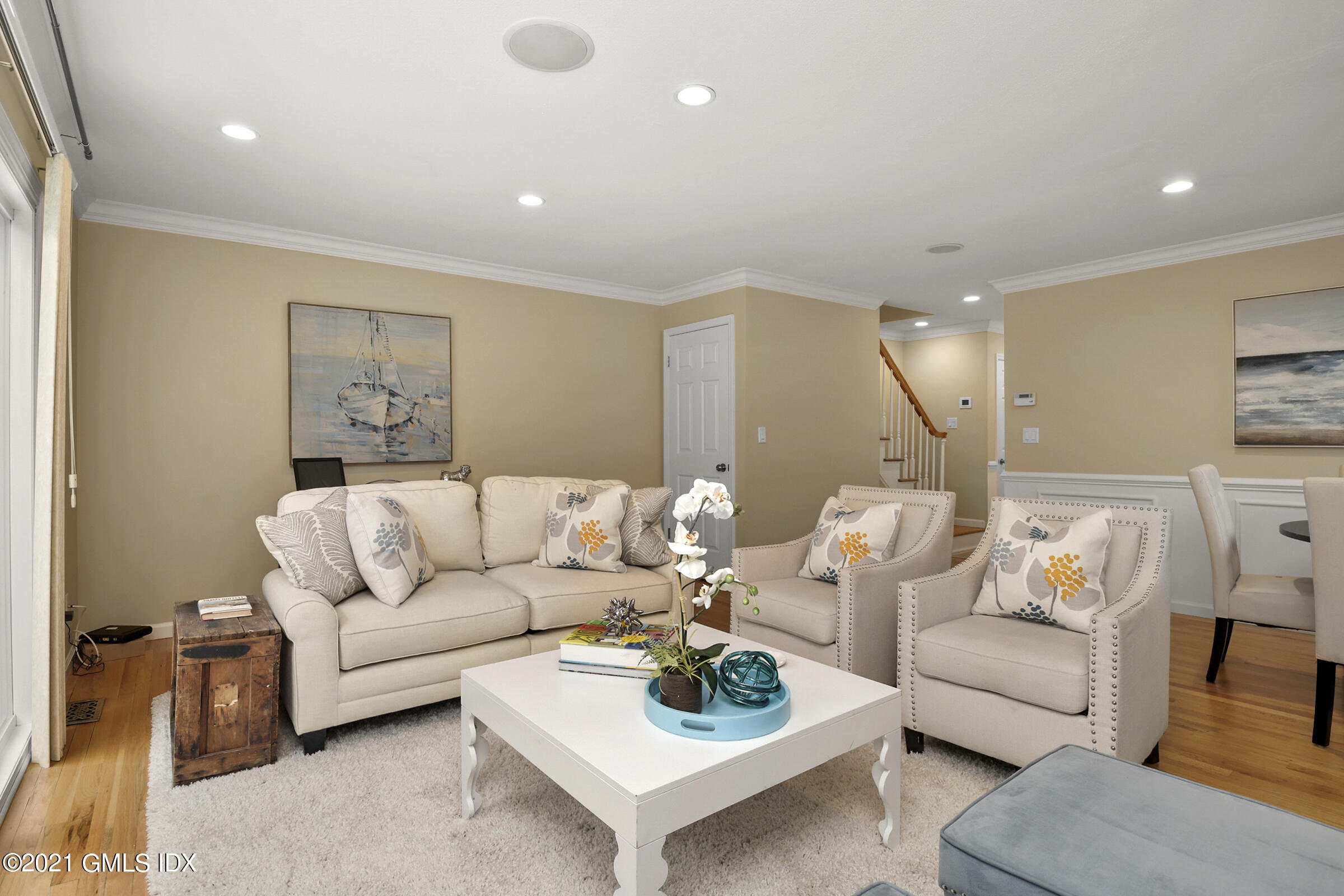 100 Strickland Road, Unit 1 Cos Cob, CT 06807 - Photo 3 of 29 a living room with furniture and a large window