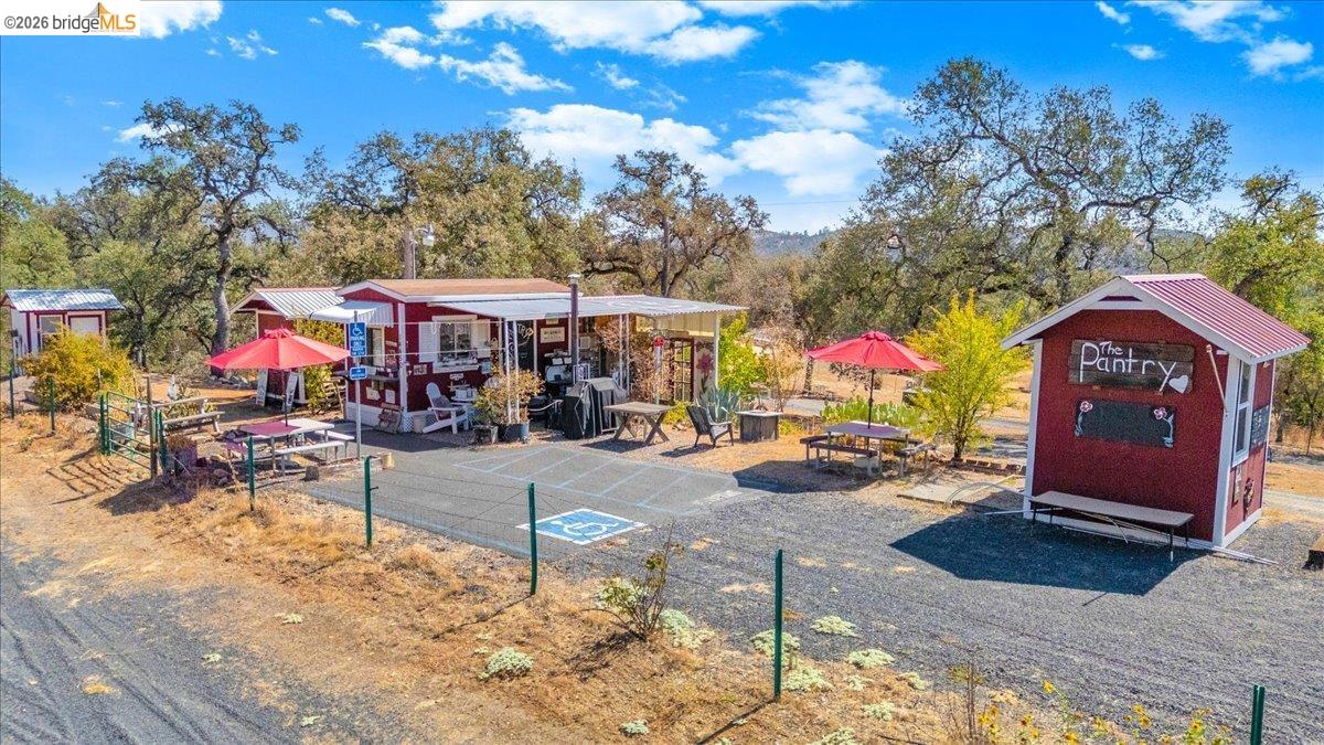 14450 Jacksonville Road Jamestown, CA 95327 - Photo 61 of 85 Multiple detached structures featuring red siding and metal roofs