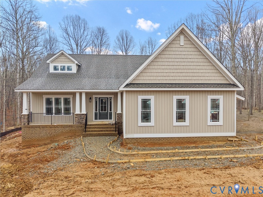 1545 Palmore Road Powhatan, VA 23139 - Photo 1 of 38 a front view of a house with a yard