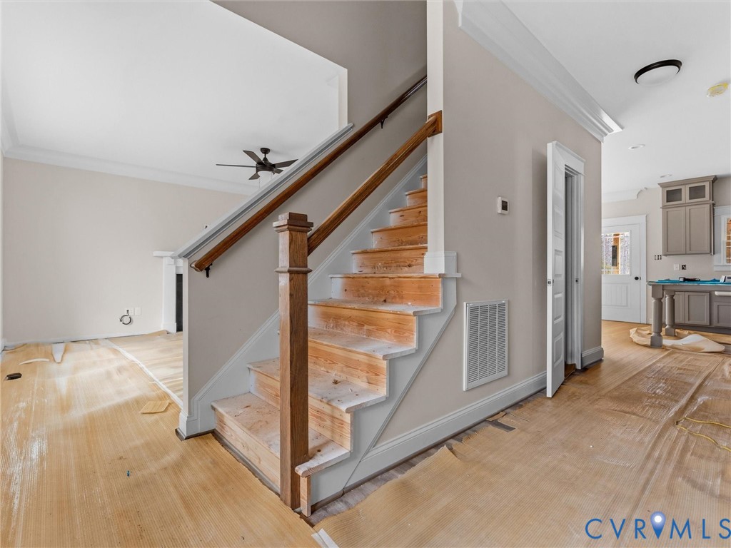 1545 Palmore Road Powhatan, VA 23139 - Photo 14 of 38 a view of a livingroom with furniture and staircase