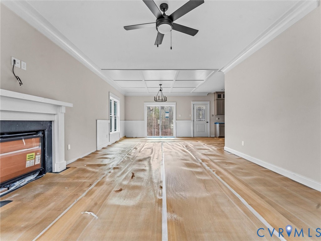 1545 Palmore Road Powhatan, VA 23139 - Photo 17 of 38 a view of a livingroom with a fireplace ceiling fan and window