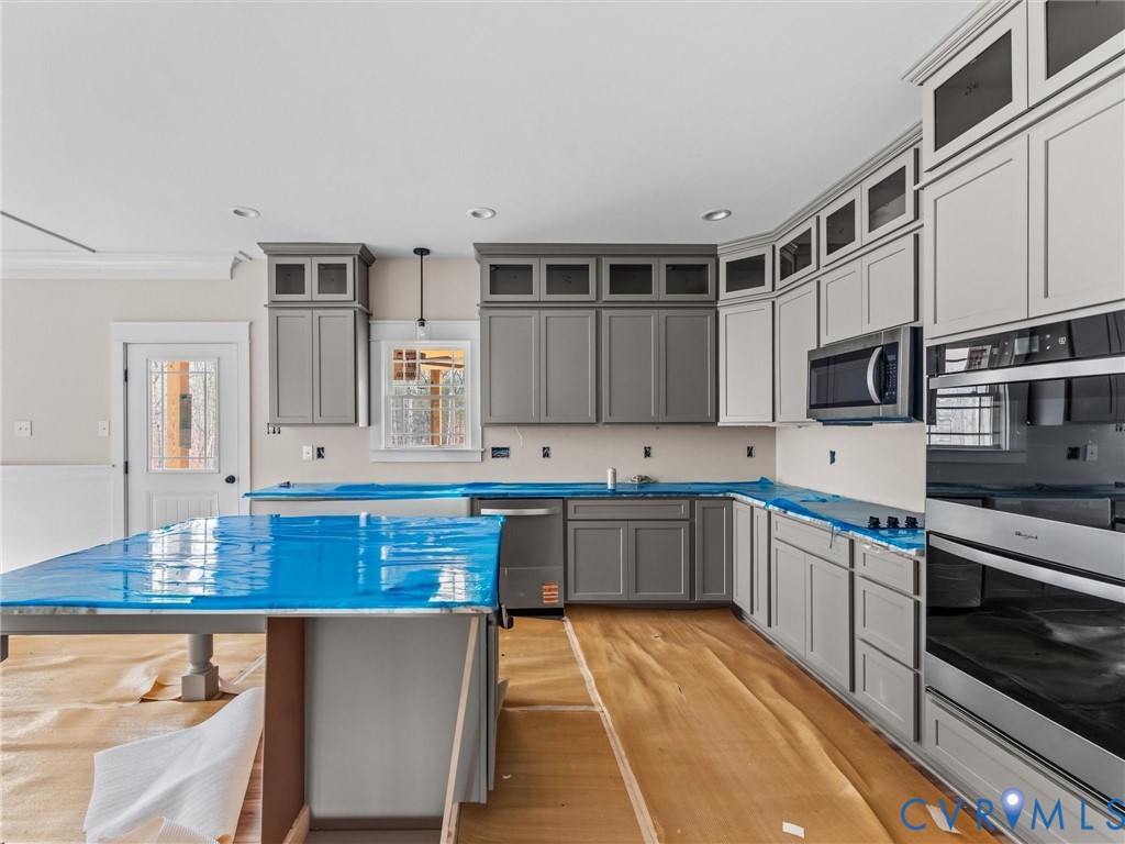 1545 Palmore Road Powhatan, VA 23139 - Photo 22 of 38 a kitchen with stainless steel appliances granite countertop a stove and a sink