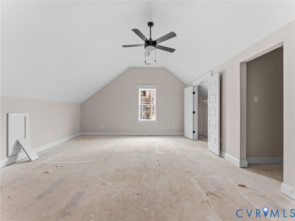 1545 Palmore Road Powhatan, VA 23139 - Photo 31 of 38 an empty room with a ceiling fan and a window