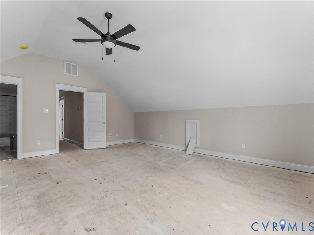 1545 Palmore Road Powhatan, VA 23139 - Photo 32 of 38 an empty room with ceiling fan and window