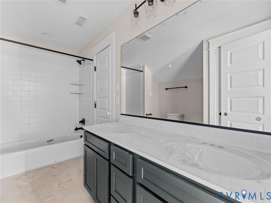 1545 Palmore Road Powhatan, VA 23139 - Photo 33 of 38 a bathroom with a sink and a mirror