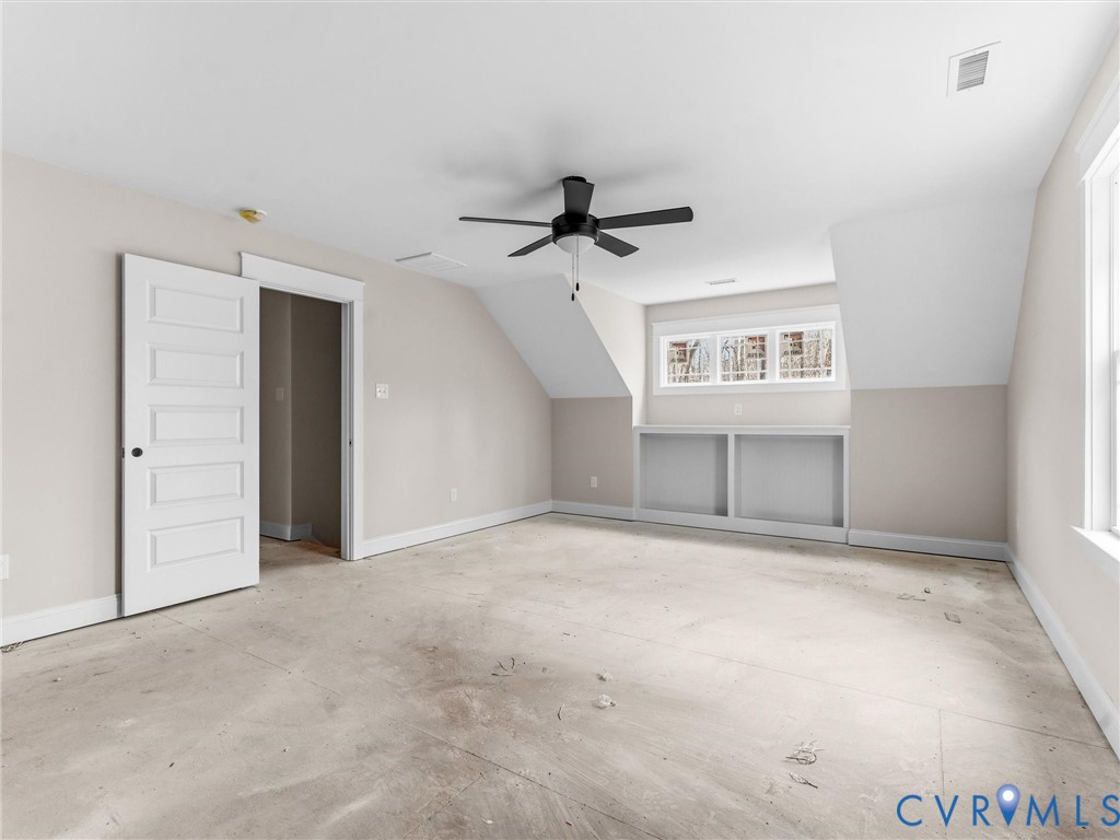 1545 Palmore Road Powhatan, VA 23139 - Photo 37 of 38 an empty room with windows and fan