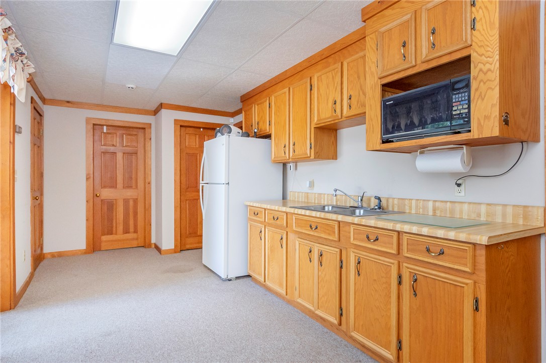 911 State Rd S-4-203 Belton, SC 29627 - Photo 32 of 49 Functional kitchen offers ample storage and essential appliances.