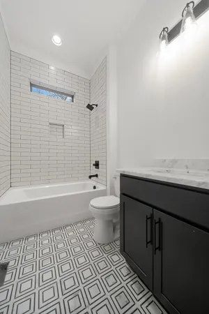 a bathroom with a sink a toilet and a bathtub