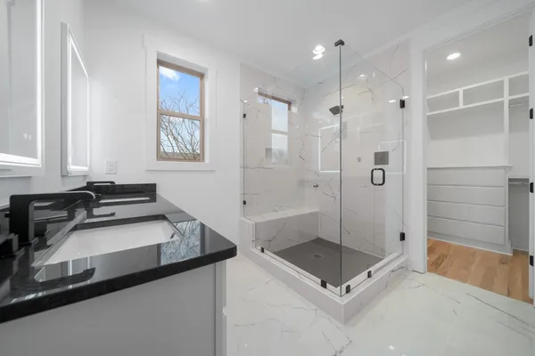 a bathroom with a sink and a shower