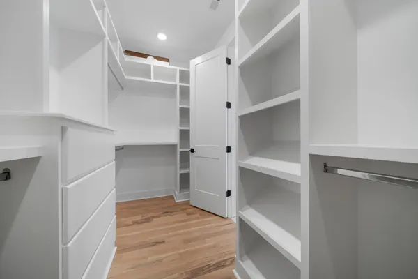 a view of an empty walk in closet