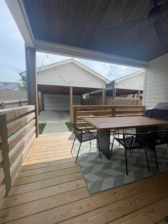 a patio with table and chairs