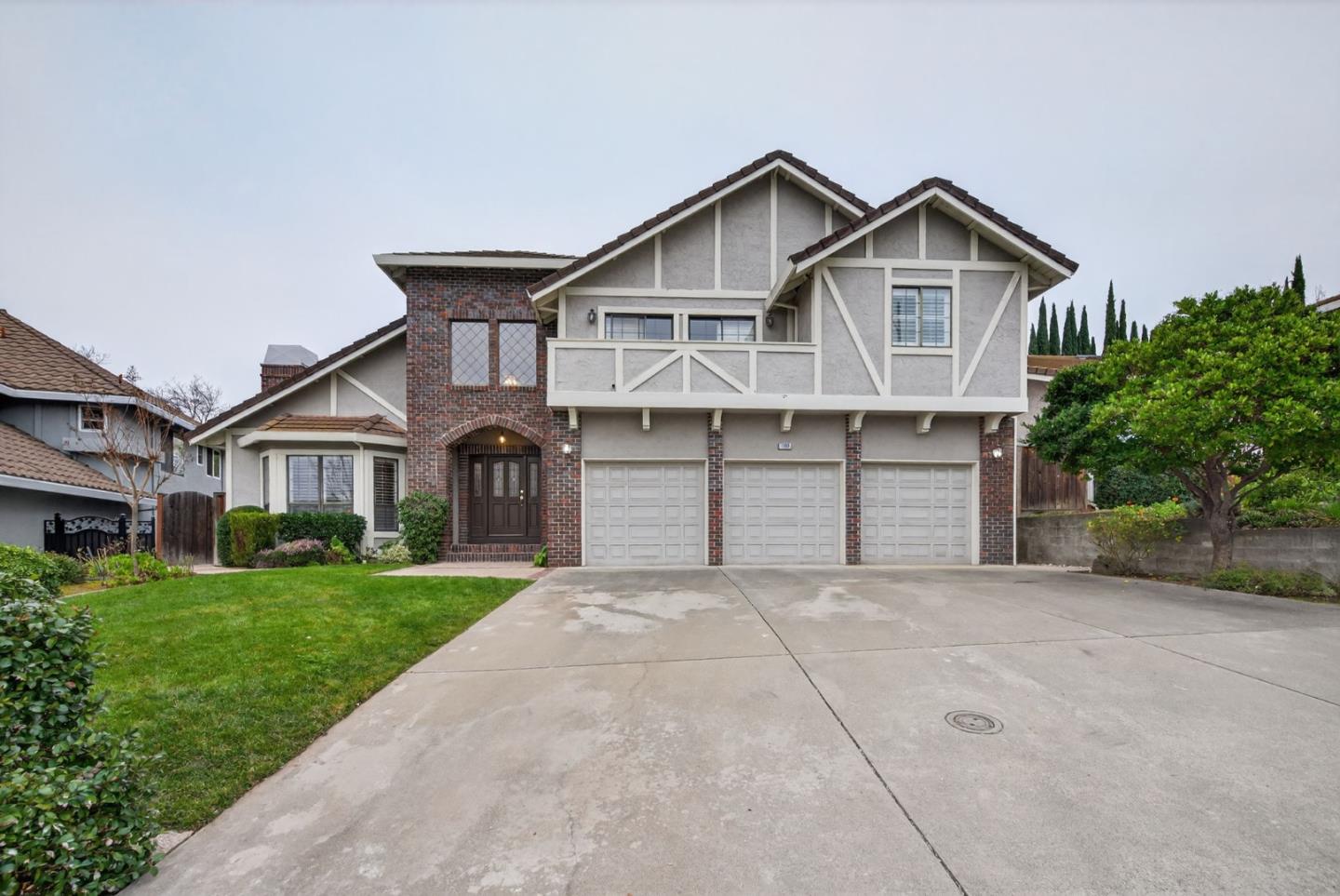 1168 Spring Hill Way San Jose, CA 95120 - Photo 1 of 73 a front view of a house with a yard and garage