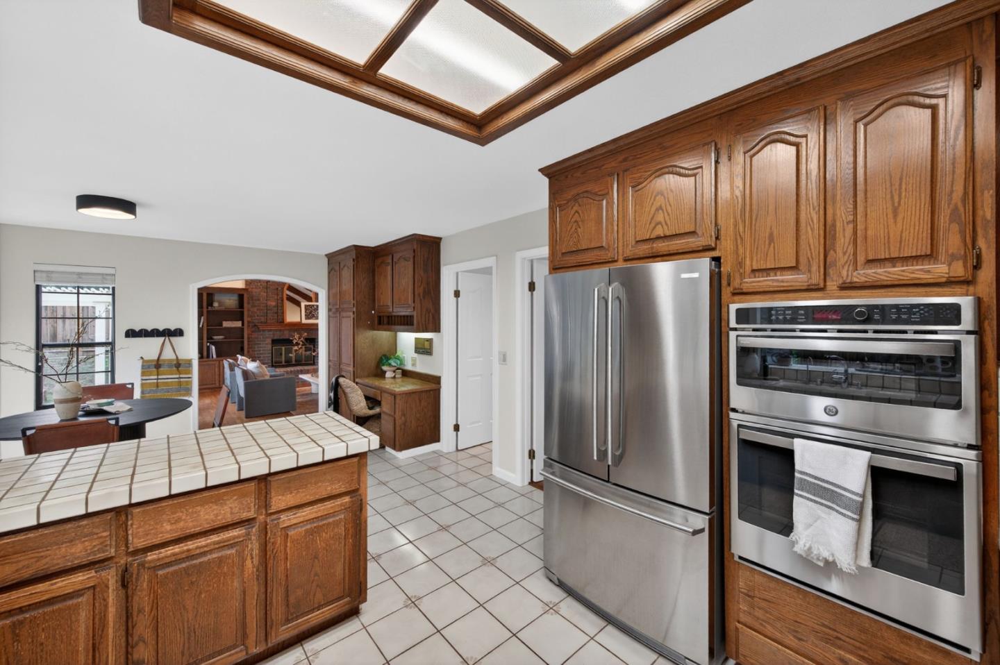 1168 Spring Hill Way San Jose, CA 95120 - Photo 18 of 73 a kitchen with stainless steel appliances granite countertop a refrigerator and wooden cabinets