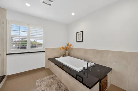 a living room with furniture and a lamp