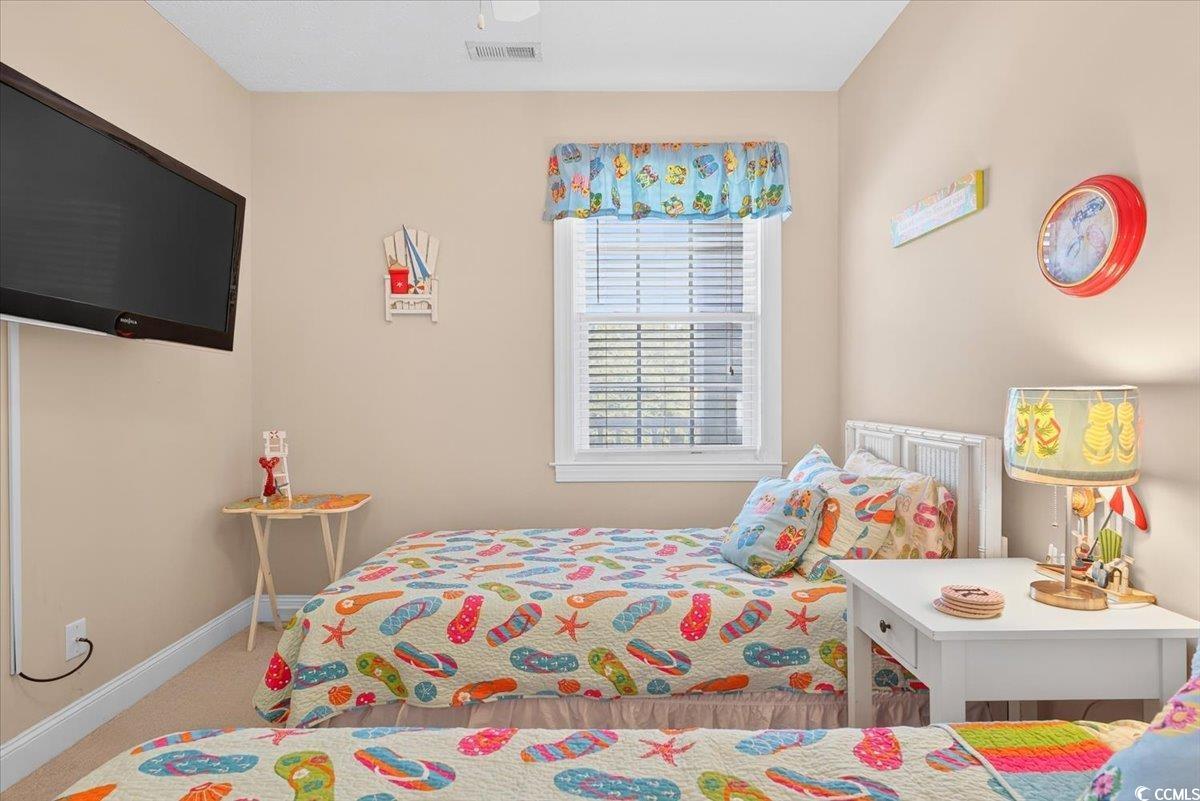 131 Waypoint Ridge Avenue, Unit 24 Little River, SC 29566 - Photo 11 of 39 Carpeted bedroom featuring baseboards and ceiling fan