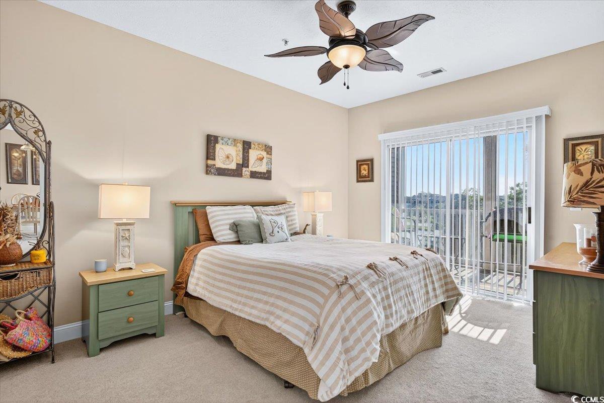 131 Waypoint Ridge Avenue, Unit 24 Little River, SC 29566 - Photo 28 of 39 Carpeted bedroom featuring access to exterior and ceiling fan