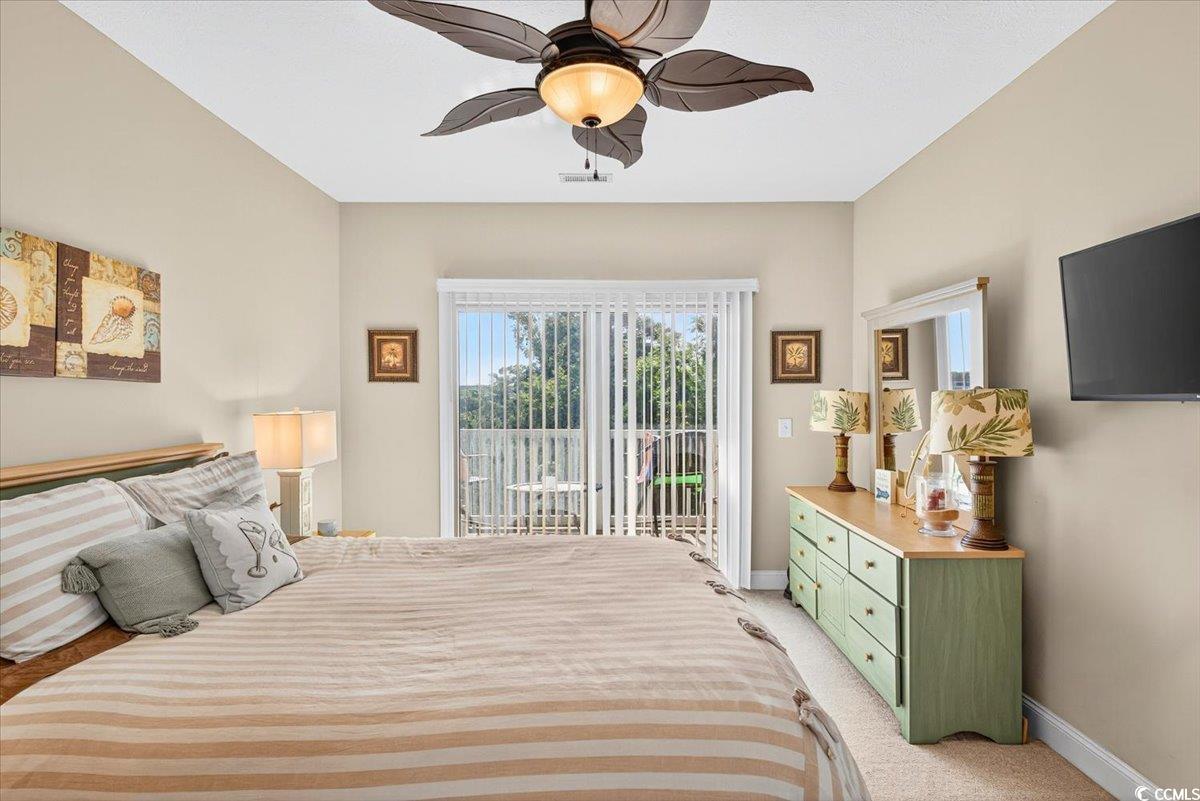 131 Waypoint Ridge Avenue, Unit 24 Little River, SC 29566 - Photo 29 of 39 Bedroom featuring light carpet, access to outside, and ceiling fan