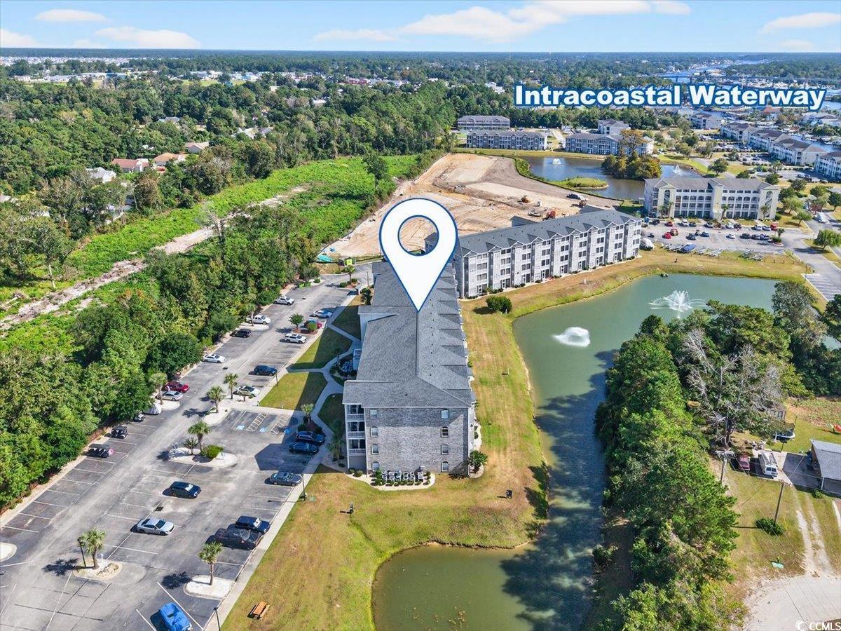 131 Waypoint Ridge Avenue, Unit 24 Little River, SC 29566 - Photo 33 of 39 Aerial view of property and surrounding area with a nearby body of water and apartment complex / building