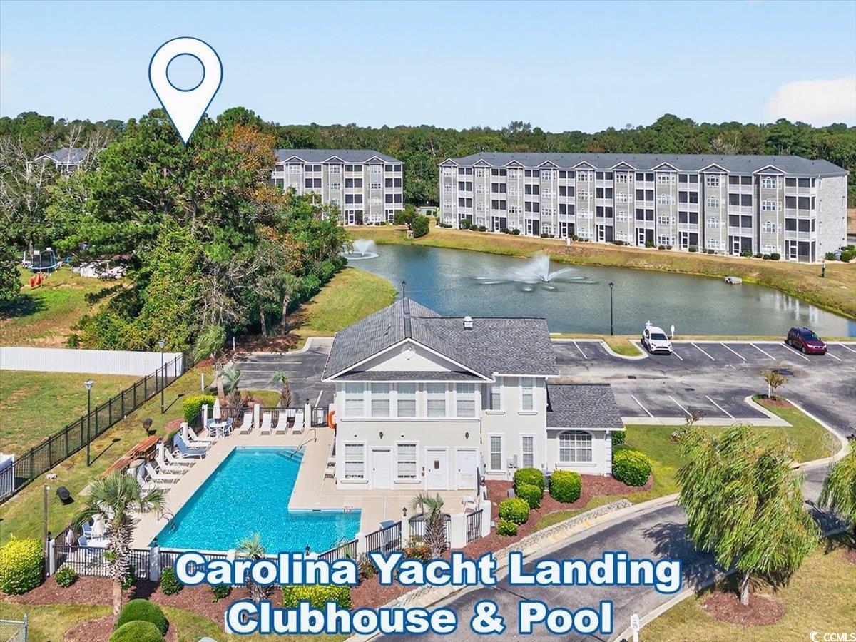 131 Waypoint Ridge Avenue, Unit 24 Little River, SC 29566 - Photo 35 of 39 Aerial view of a pool and a nearby body of water