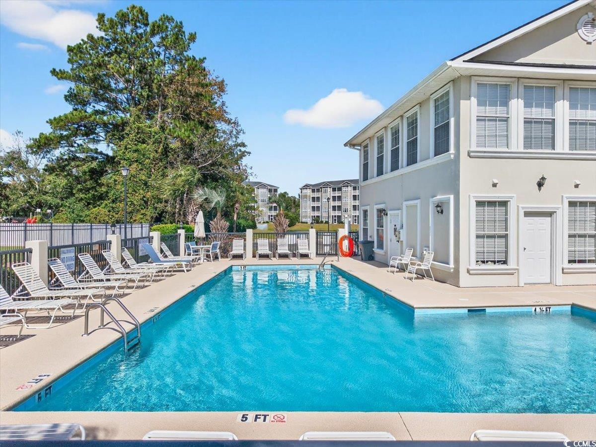 131 Waypoint Ridge Avenue, Unit 24 Little River, SC 29566 - Photo 38 of 39 Community pool featuring a patio