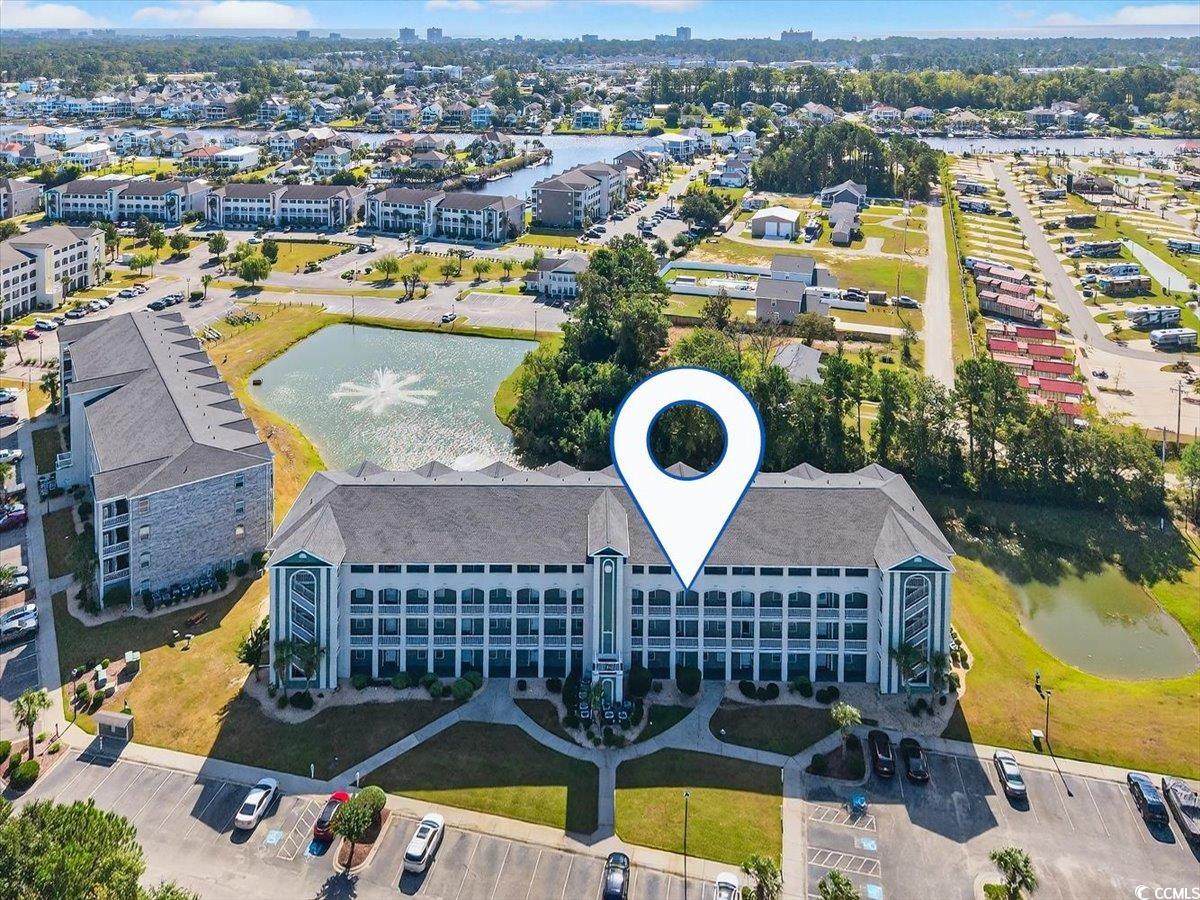 131 Waypoint Ridge Avenue, Unit 24 Little River, SC 29566 - Photo 4 of 39 Aerial view of a nearby body of water and apartment complex