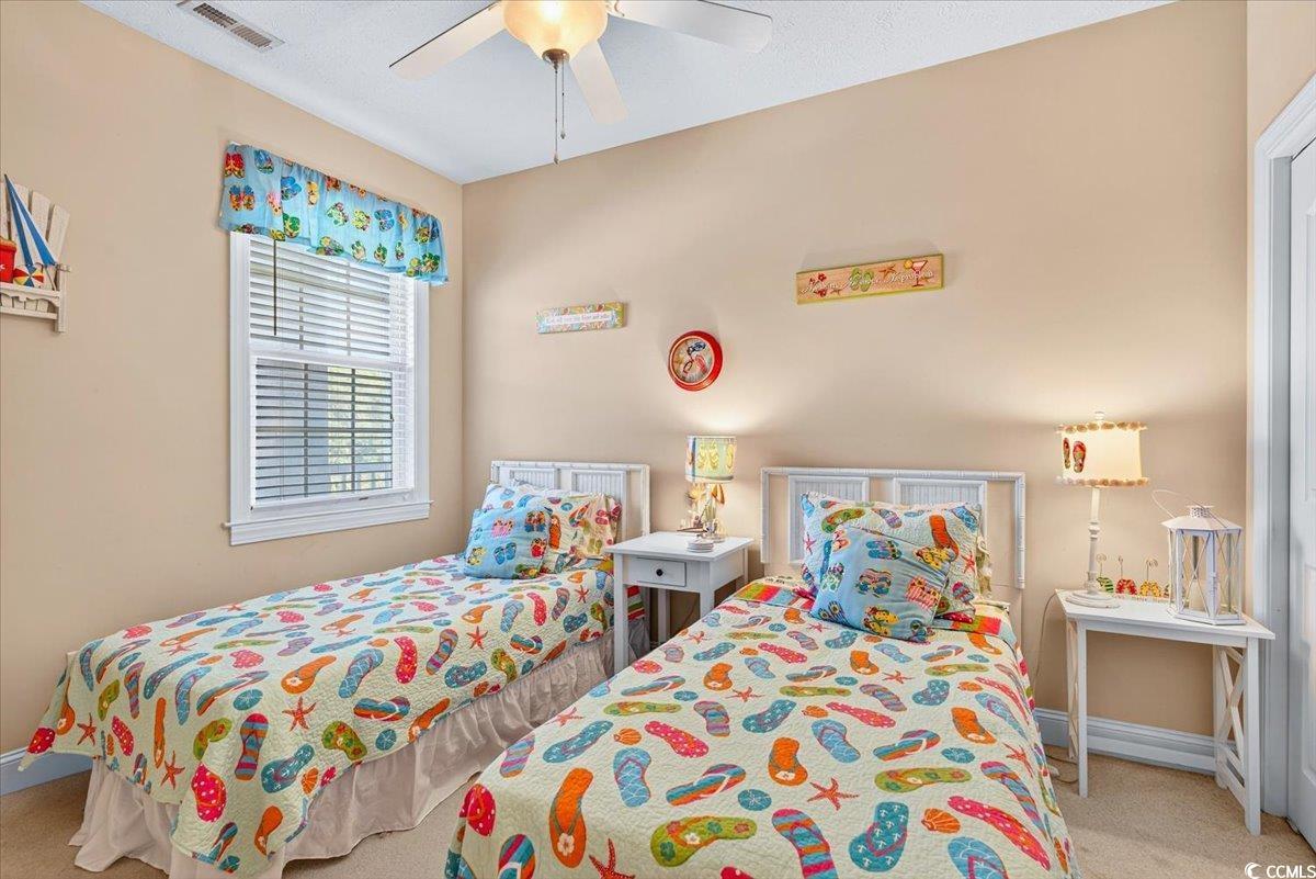 131 Waypoint Ridge Avenue, Unit 24 Little River, SC 29566 - Photo 10 of 39 Bedroom with light carpet and ceiling fan