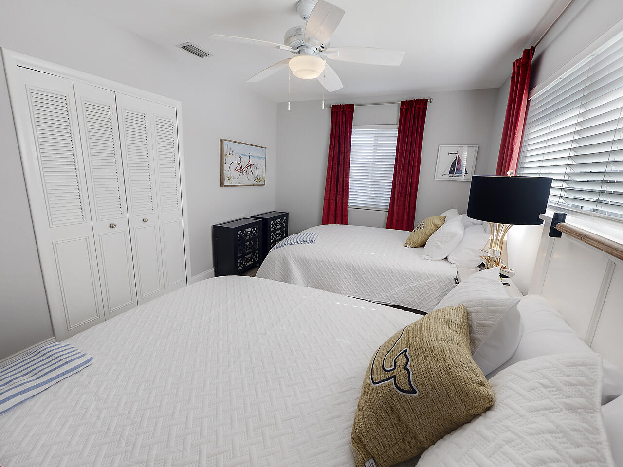 1236 Beach Road, Unit 3 Singer Island, FL 33404 - Photo 10 of 25 a bedroom with a bed and a window