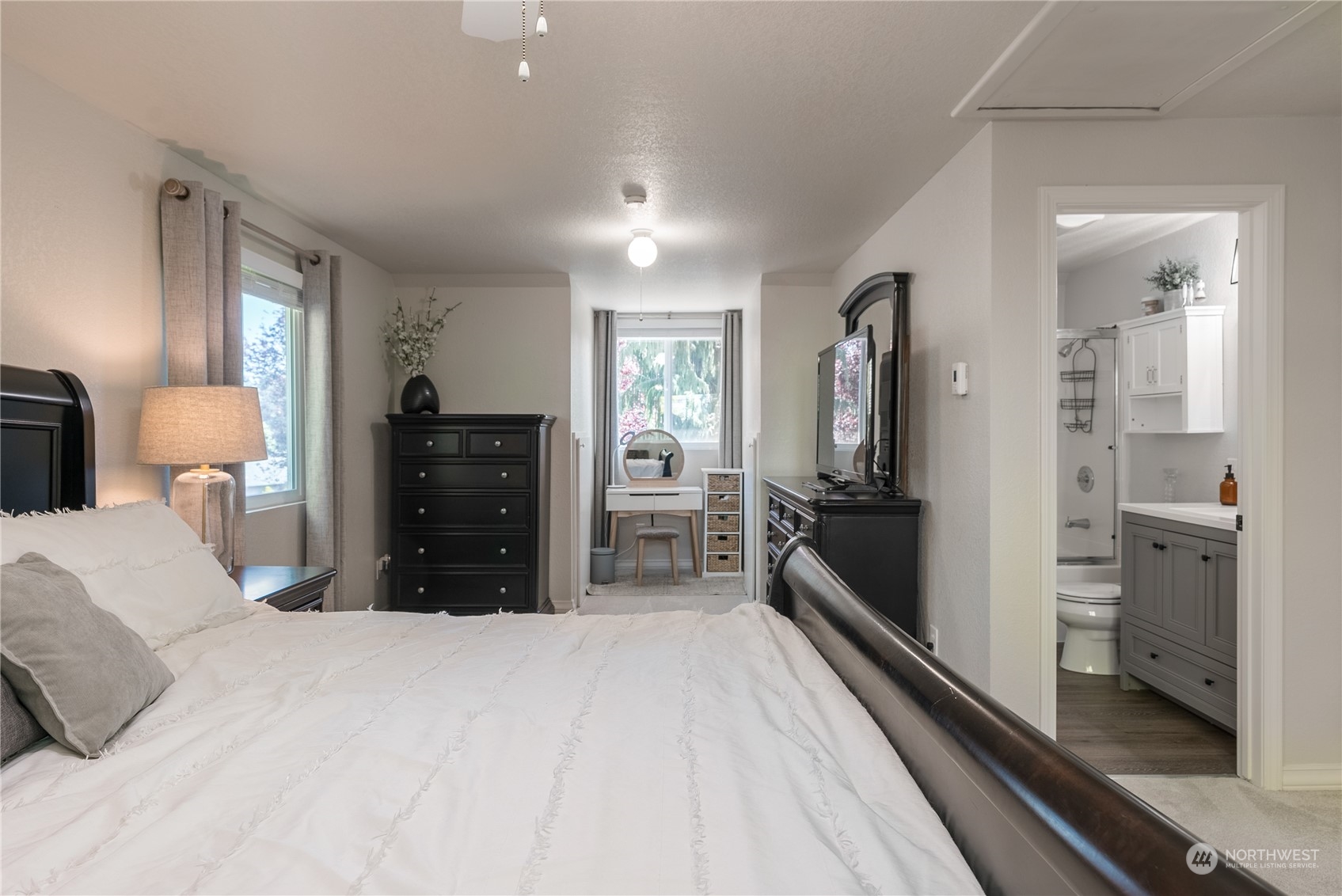 16520 4th Drive Southeast Bothell, WA 98012 - Photo 12 of 32 a large bedroom with a bed and a large window