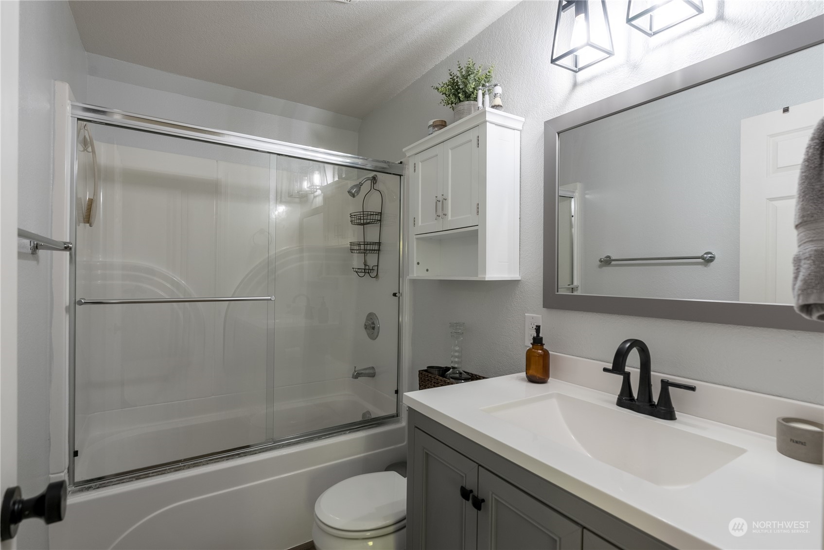 16520 4th Drive Southeast Bothell, WA 98012 - Photo 15 of 32 a bathroom with a sink toilet and shower