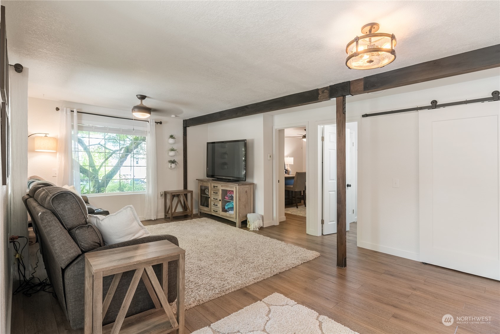 16520 4th Drive Southeast Bothell, WA 98012 - Photo 8 of 32 a living room with furniture a flat screen tv and a window