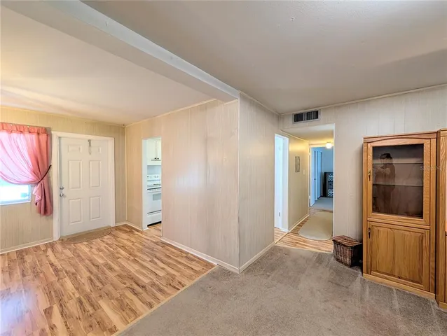a spacious bathroom with a granite countertop sink and a mirror