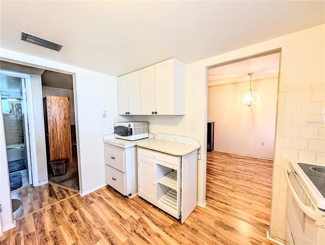 a kitchen with a stove and a refrigerator