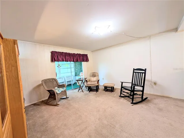 a room with furniture and a large window